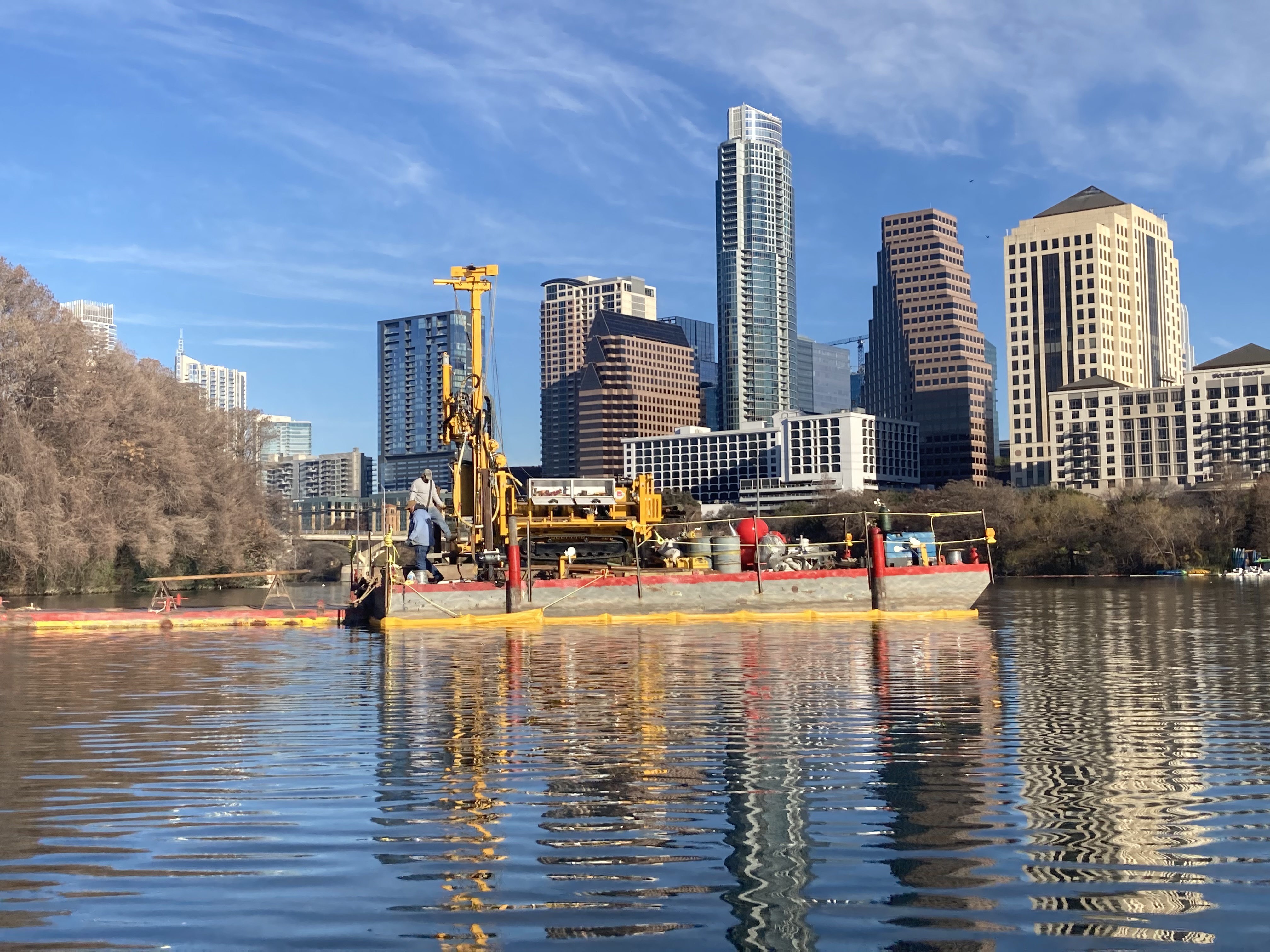 Drilling barge on a lake near the shoreline